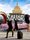 PPVS Private Shoot A private photoshoot in with the Sahara sign in the background, with a woman posing in front of a classic pink Cadillac.