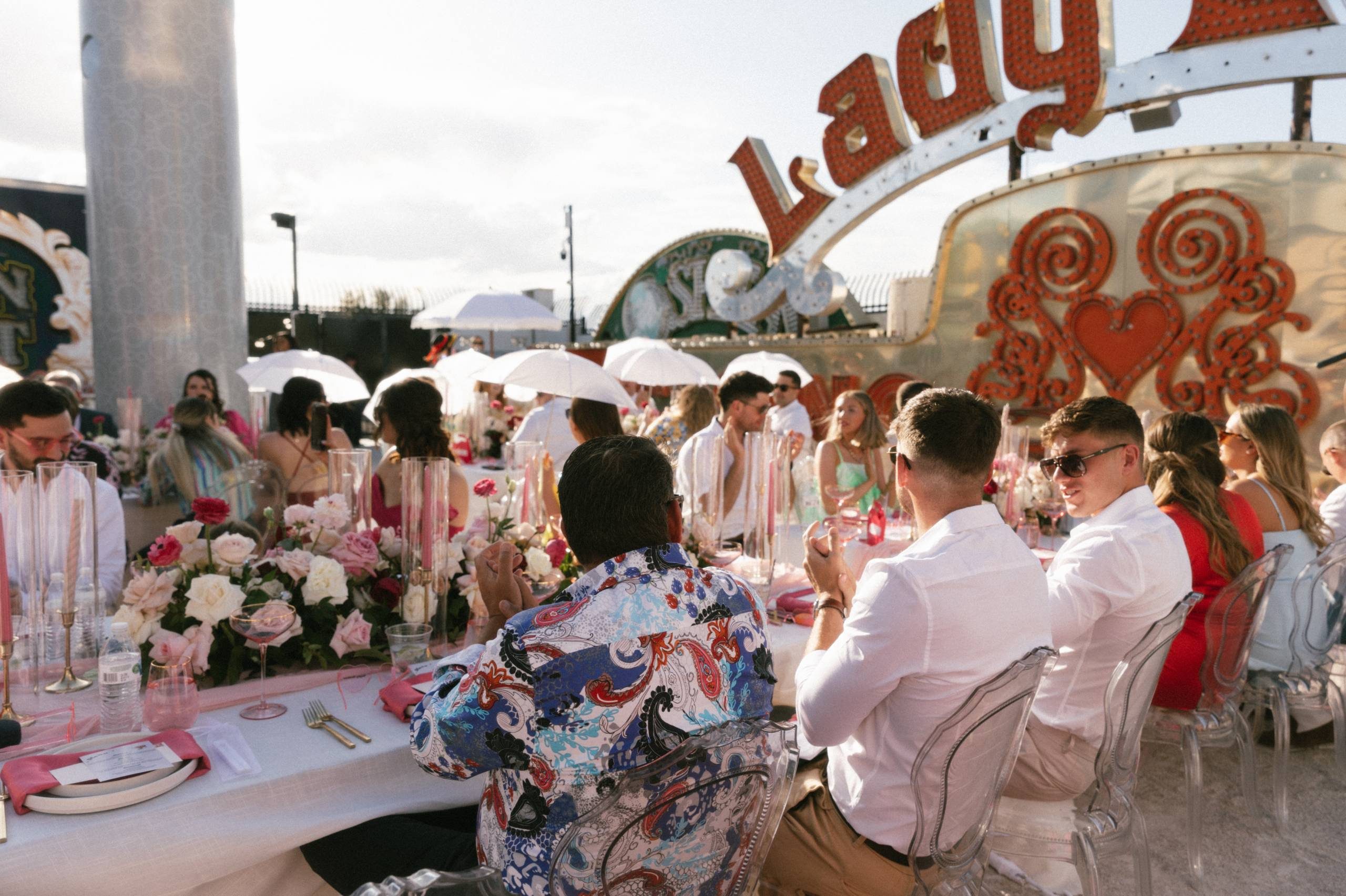 A group of people at a catered event at The Neon Museum's North Gallery.
