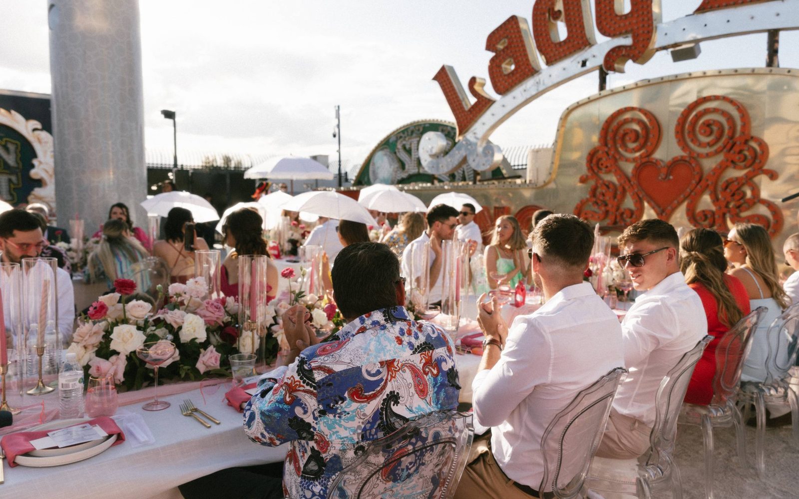 A group of people at a catered event at The Neon Museum's North Gallery.