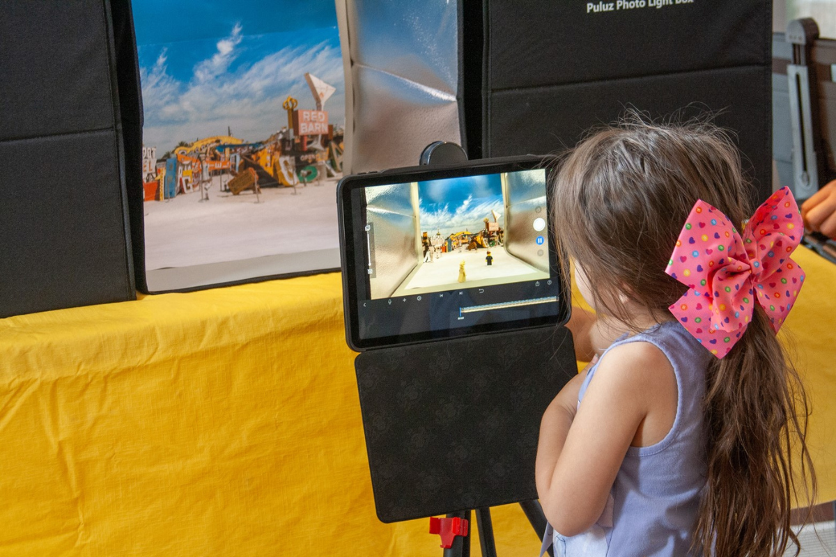 A child animates at The Neon Museum