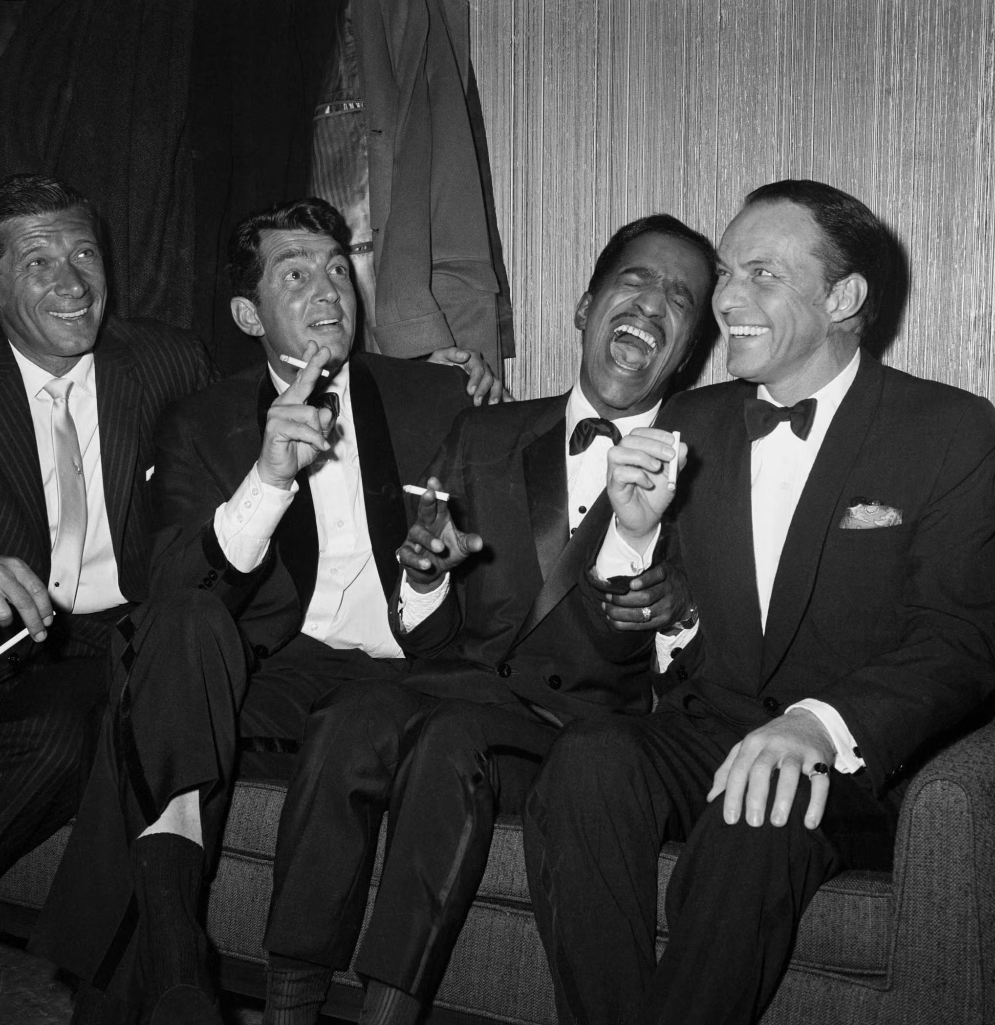 Rat Pack members Dean Martin, Sammy Davis Jr., and Frank Sinatra seen backstage after performing a benefit at Carnegie Hall in honor of Dr. Martin Luther King Jr. in January 1961.