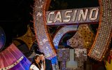 A couple standing in front of the Binion's Horseshoe in the North Gallery.