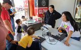 Children playing with a sound system during STEAM Family Fest