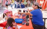 Rainbow company doing learning activities with STEAM Family Fest.