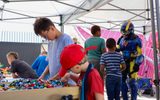 Children building with plastic bricks during STEAM Family Fest