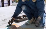 Chalk artist paints the patio during STEAM Family Fest.